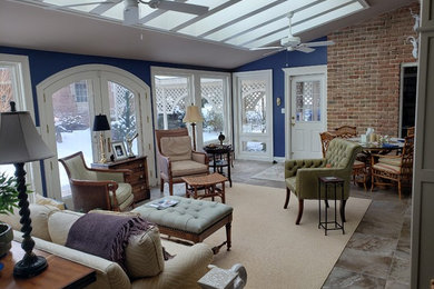 Mid-sized elegant slate floor and gray floor sunroom photo in Other with a skylight