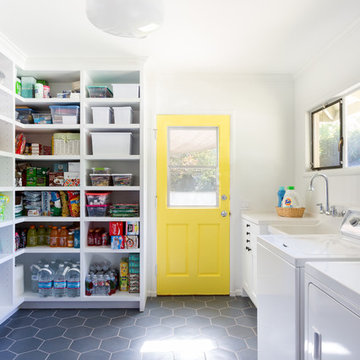 Colorful Laundry Room with Custom Cabinets & Yellow Door