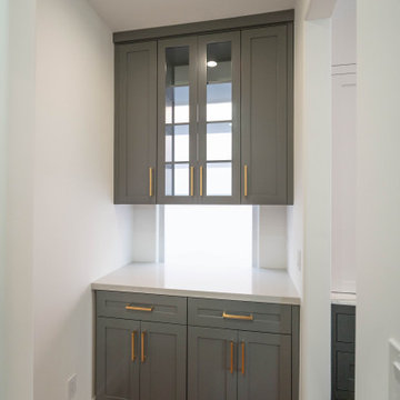 A refined storage nook with gray cabinetry