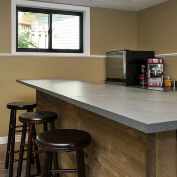 Black Sliding Window in Attractive Finished Basement - Renewal by Andersen Great