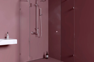 ストックホルムにある北欧スタイルのおしゃれなバスルーム (浴槽なし) (コーナー設置型シャワー、ピンクのタイル、ライムストーンタイル、ピンクの壁、ピンクの床、開き戸のシャワー) の写真