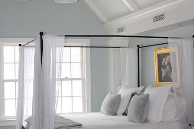 Bedroom - large transitional master dark wood floor bedroom idea in New York with blue walls, a standard fireplace and a tile fireplace