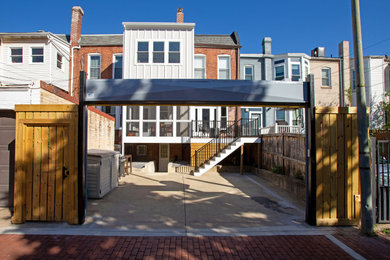 Example of a small trendy white three-story mixed siding and board and batten townhouse exterior design in DC Metro with a shingle roof, a gray roof and a shed roof