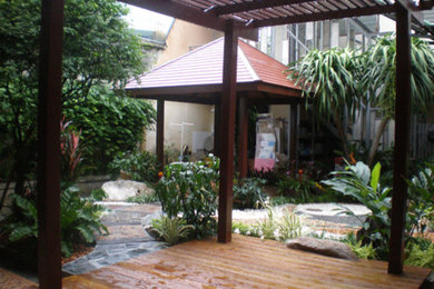 Inspiration for a tropical patio remodel in Other