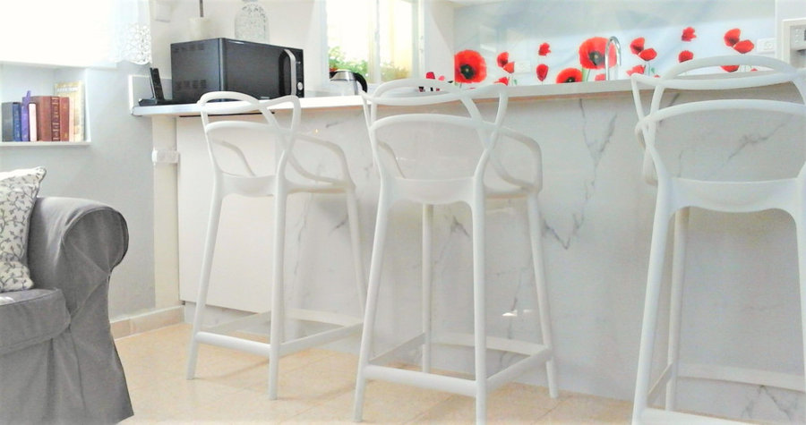 NOT granite island with modern chairs
