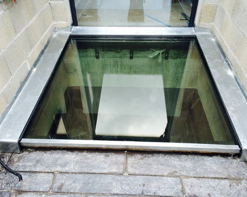 installation de puits de fenêtre fenêtres de sous-sol