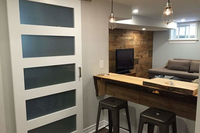 Basement - modern basement idea in Ottawa