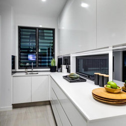 Kitchen area with a double bay Breezway Louvre using tinted glass blades - Windows