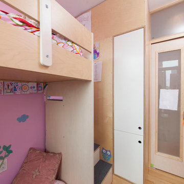 Boerum Hill; A small face is fitted with a loft bed and built-in cabinets