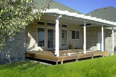 Design ideas for a backyard patio in Salt Lake City with a roof extension.