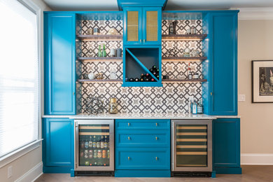 Inspiration for a mid-sized contemporary single-wall dark wood floor home bar remodel in Raleigh with flat-panel cabinets, blue cabinets, quartz countertops and multicolored backsplash