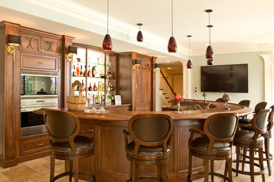Seated home bar - traditional seated home bar idea in Columbus with recessed-panel cabinets, dark wood cabinets, wood countertops and brown countertops