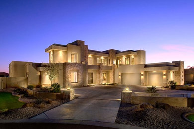 Huge minimalist two-story mixed siding flat roof photo in Phoenix