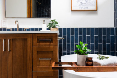 Bathroom - small transitional blue tile bathroom idea in Seattle with shaker cabinets, medium tone wood cabinets and a built-in vanity