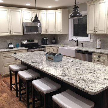 Two-Toned Kitchen with Traditional Cabinet Door Style and Large Island