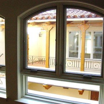 view of porch and living room from the family room cross the patio