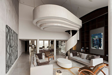 Photo of a contemporary formal living room in London with brown walls and marble floors.