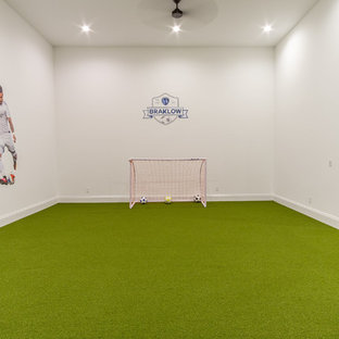 Classic fully buried basement in Kansas City with white walls and green floors.