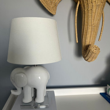 Nursery with elephant lamp and wicker elephant head