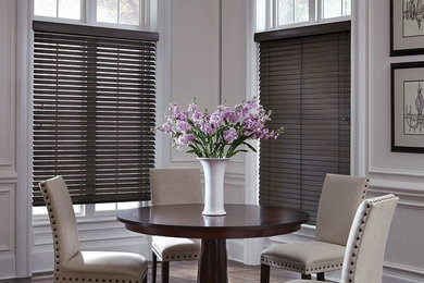 Inspiration for a mid-sized transitional dark wood floor enclosed dining room remodel in Chicago with gray walls and no fireplace