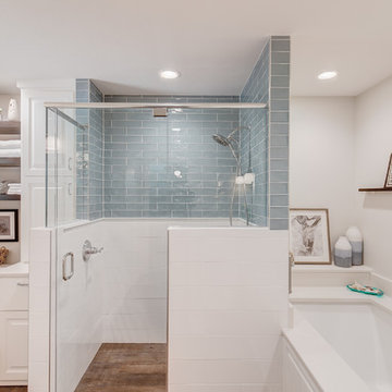 Cozy Master Bathroom With Eye Popping Blue Tiled Shower