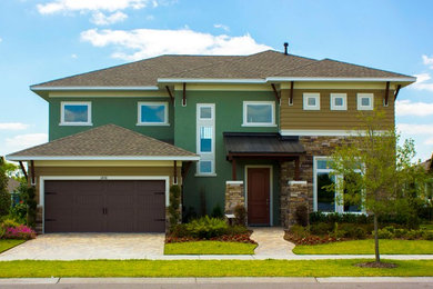 Green two-story exterior home idea in Tampa