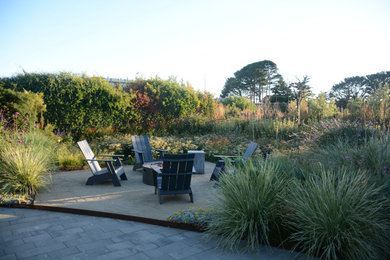 Inspiration for a coastal front yard decomposed granite patio remodel in San Francisco with a fire pit