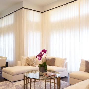 Floor to ceiling Drapes and Motorized Roller Shades
