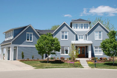 Inspiration for a large traditional two-storey blue house exterior in Denver with concrete fiberboard siding, a gable roof and a shingle roof.