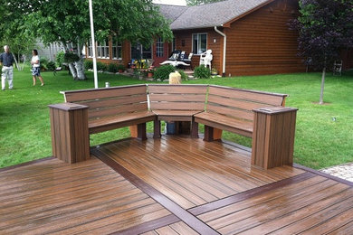 Example of a mid-sized beach style backyard dock design in Other with no cover