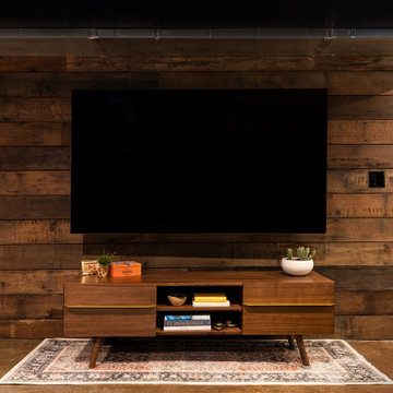 A Reclaimed Wood Wall Frames the TV