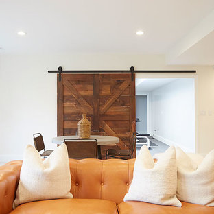 Design ideas for a large traditional walk-out basement in Chicago with beige walls, carpet, a standard fireplace, a plastered fireplace surround and beige floors.