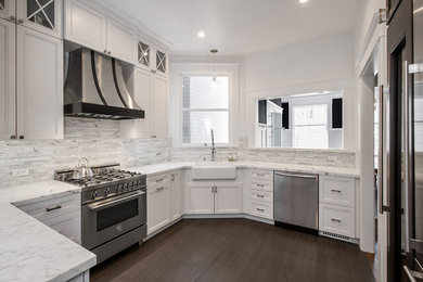 Design ideas for a mid-sized contemporary u-shaped separate kitchen in San Francisco with a farmhouse sink, raised-panel cabinets, grey cabinets, marble benchtops, grey splashback, marble splashback, stainless steel appliances, porcelain floors, grey floor and white benchtop.