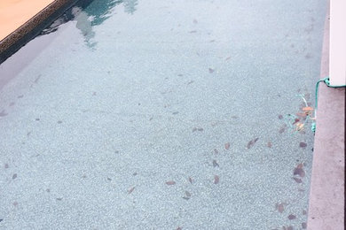 Inspiration for a mid-sized backyard rectangular lap pool remodel in Other