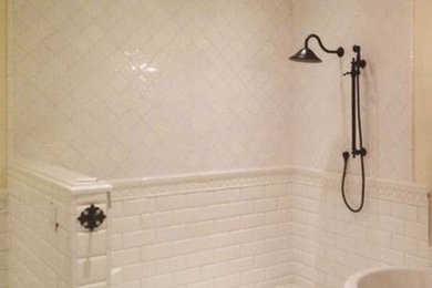 Freestanding bathtub - traditional white tile freestanding bathtub idea in Los Angeles