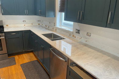 Kitchen photo in Chicago with quartzite countertops and beige countertops