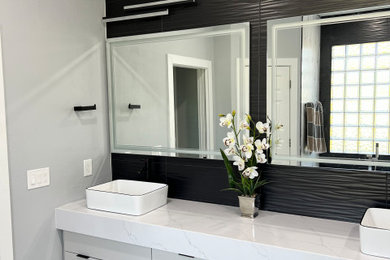 Bathroom - mid-sized contemporary master black tile and ceramic tile porcelain tile, white floor and double-sink bathroom idea in Orlando with flat-panel cabinets, gray cabinets, gray walls, a vessel sink, quartz countertops, white countertops and a built-in vanity