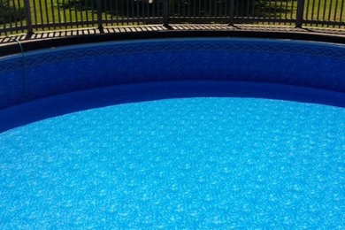 Pool - large backyard pool idea in Milwaukee