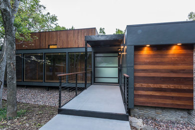 Contemporary gray split-level mixed siding flat roof idea in Louisville