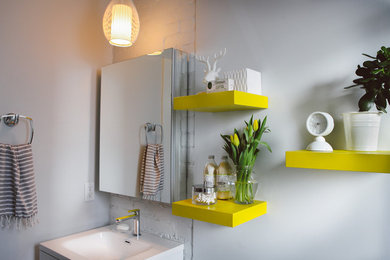 Example of a small trendy 3/4 white tile and ceramic tile bathroom design in Toronto with flat-panel cabinets, white cabinets, white walls, an integrated sink and solid surface countertops