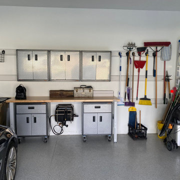 Workbench with storage on casters and wall-hung upper cabinets