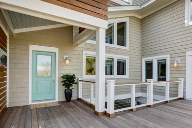 Example of a large trendy beige three-story exterior home design in Wilmington