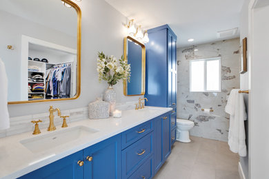 Example of a mid-sized classic master gray tile and porcelain tile porcelain tile, gray floor and double-sink bathroom design in Portland with shaker cabinets, blue cabinets, a one-piece toilet, gray walls, an undermount sink, quartz countertops, white countertops, a niche and a built-in vanity