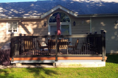 Inspiration for a backyard deck remodel in New York with no cover