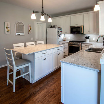 White Shaker Kitchen w/ Pietra Quartz Countertops & Gray Subway Tile Backsplash