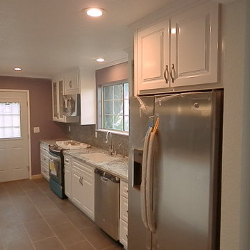 Full size upper cabinets above fridge.