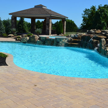 Custom Pools & Spas, Outdoor Kitchens, Patios & Walkways, and Plantings