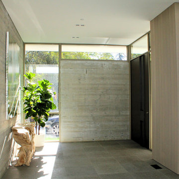 California Modern Entry with Sculptural Console and Concrete Wall