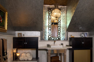 Inspiration for a mid-sized contemporary master black tile and stone tile marble floor bathroom remodel in Richmond with a vessel sink, raised-panel cabinets, dark wood cabinets, concrete countertops, a one-piece toilet and gray walls