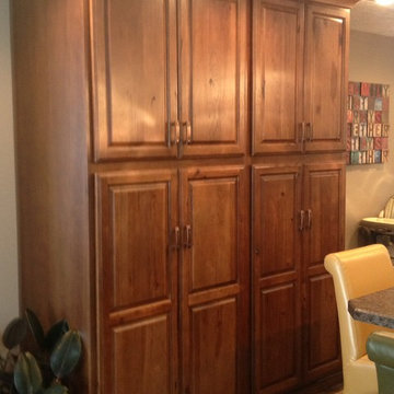 This pantry, broom closet and coat space keeps items close and accessable!